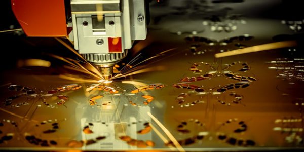 CNC-laser-cutting-machine-cutting-designs-into-metal-sheet
